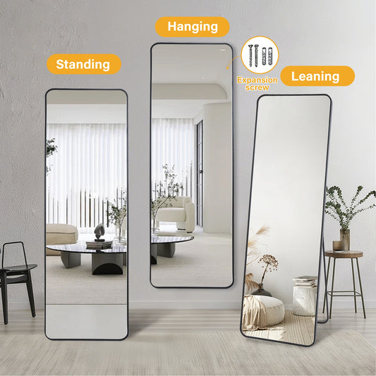 Black frame full length mirror leaning against wall